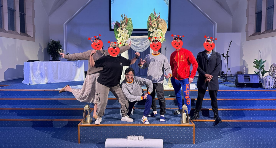 The bride and groom wore matching ALDI track sets and an ALDI embroidered veil for their wedding rehearsal