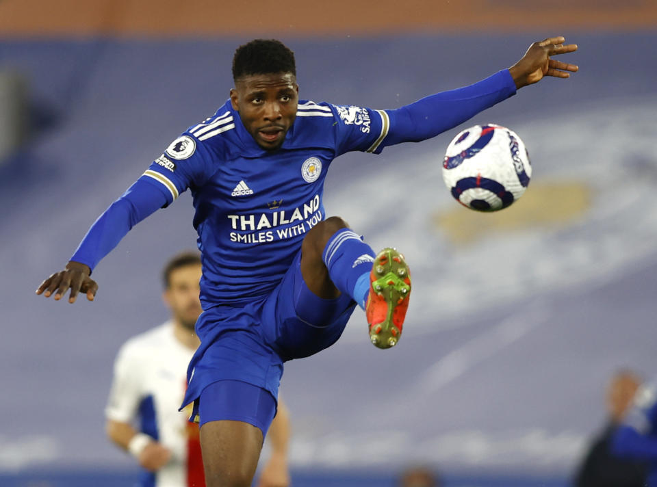 Leicester's Kelechi Iheanacho controls the ball during the English Premier League soccer match between Leicester City and Crystal Palace at the King Power Stadium in Leicester, England, Monday, April 26, 2021. (Adrian Dennis/Pool via AP)