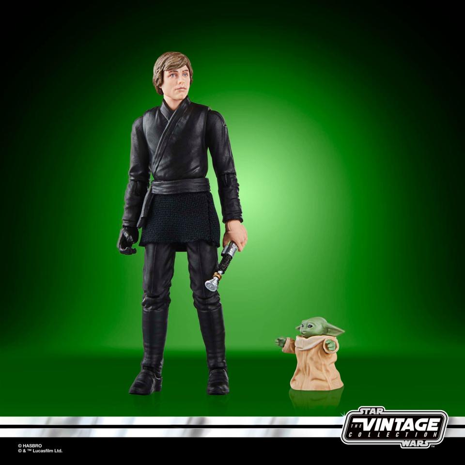 Star Wars Luke and Grogu action figures posed against a green background