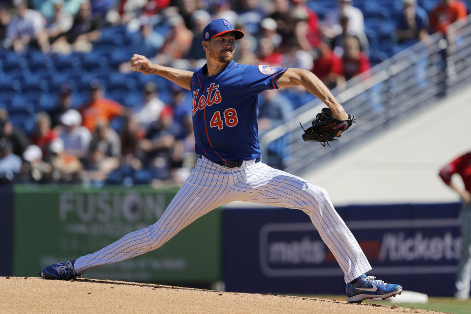 New York Mets pitcher Jacob deGrom throws during the first inning of a spring training baseball game against the Washington Nationals Sunday, March 1, 2020, in Port St. Lucie, Fla. (AP Photo/Jeff Roberson)