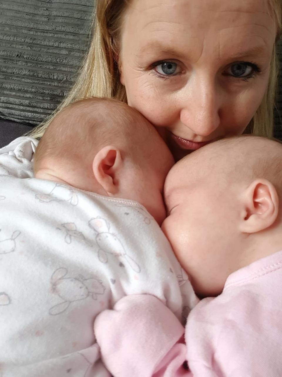 A mum of identical twin has faced a medical nightmare - one sister is perfectly healthy while the other is struck down with a rare illness from coronavirus.  Mum Hannah Godwin spotted five-month-old Leia with a rash and high temperature next to her "healthy and happy" twin.  It struck her even more because identical twin Thea was completely fine - and the difference may have saved her sister's life.  Little Leia was rushed to hospital in the nick of time to be treated for an inflammatory disease in young children linked with an extreme reaction to Covid-19.  Pictured here are Hannah & twins Leia & Thea.  © Hannah Godwin/WALES NEWS SERVICE    