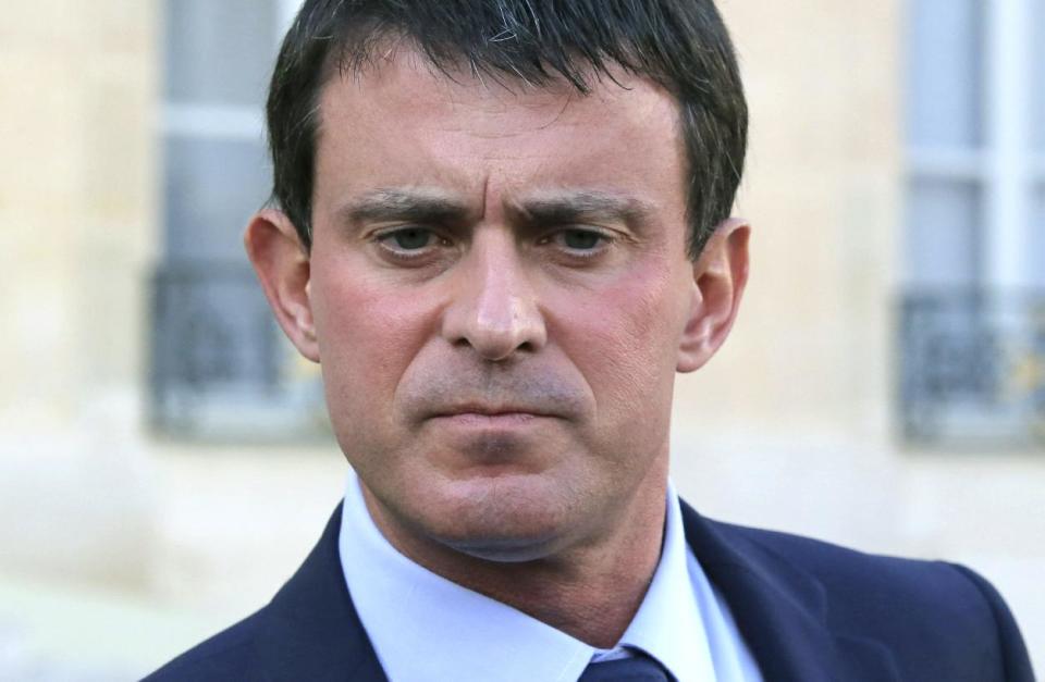 FILE - In this Oct. 23, 2013 file photo French Interior Minister, Manuel Valls pauses as he speaks to the media at the Elysee Palace in Paris. France's president has named 51-year-old Socialist Manuel Valls as the country's new prime minister, it was announced, Monday, March 31, 2014. In a prerecorded televised speech, Francois Hollande said Valls, the former interior minister, would lead a "combative government." (AP Photo/Michel Euler, File)