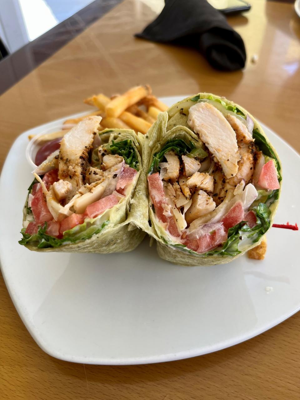 Southwest chicken wrap with ranch dressing, blackened chicken, homemade BBQ sauce, pepperjack cheese, onions, tomatoes and fresh mixed field greens from Stillwater Grille.