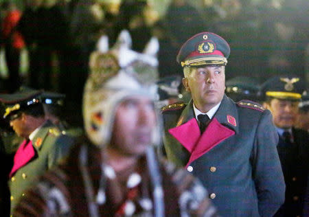 A high-ranking army officer attends a vigil during a satelite transmission of Bolivia and Chile presenting their arguments at the World Court, in La Paz, Bolivia, March 19, 2018. REUTERS/David Mercado