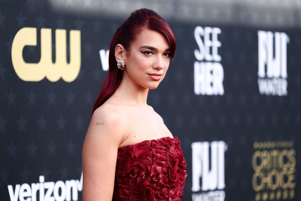 dua lipa in a red dress