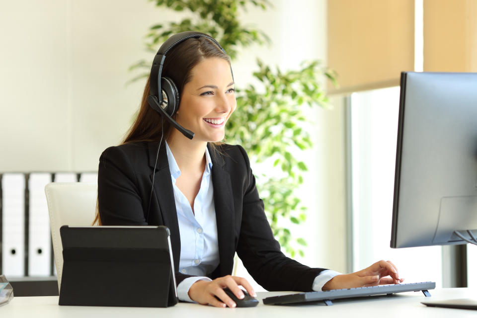 Tele marketer working at office with computer