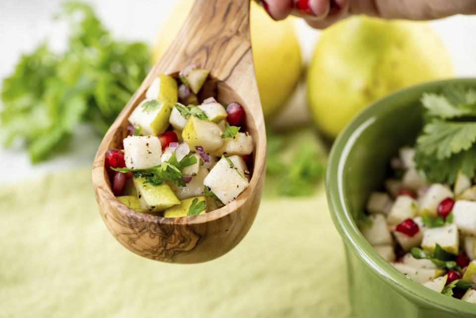 This image shows a recipe for spice pear and cilantro salsa. While everyone loves a classic tomato-based salsa, you can shake things up with different fruit-based salsas. (Cheyenne Cohen via AP)