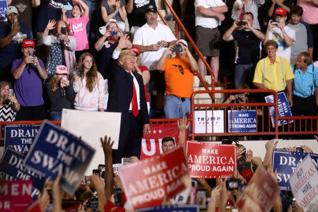 FILE PHOTO: U.S. President Donald Trump appears on stage at a rally in Harrisburg, Pennsylvania, U.S. April 29, 2017. REUTERS/Carlo Allegri/File Photo