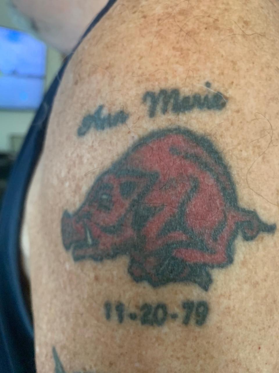 Mick Burroughs's Arkansas Razorbacks tattoo memorializes his daughter Ann, who died in 1998.