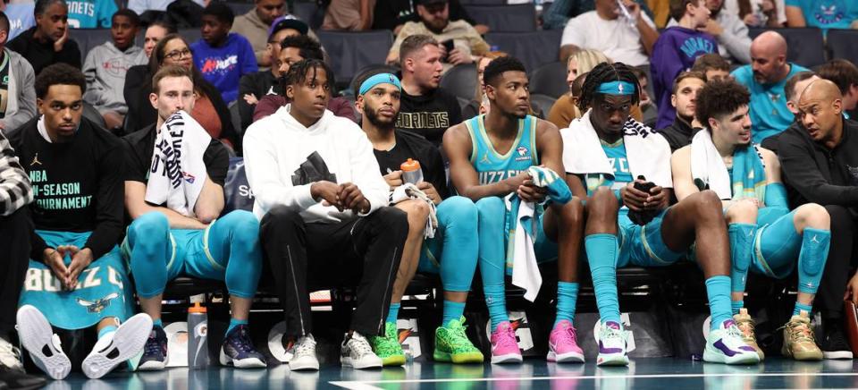 The Charlotte Hornets starters and bench reflect the team’s play during second half action against the Milwaukee Bucks on Friday, November 17, 2023 at Spectrum Center in Charlotte, NC. The Bucks defeated the Hornets 130-99.