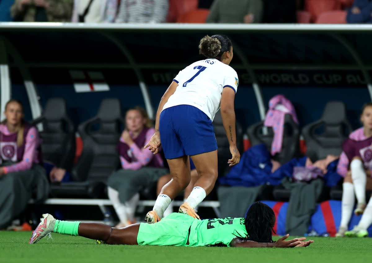 Lauren James of England stamps Michelle Alozie of Nigeria (PA)