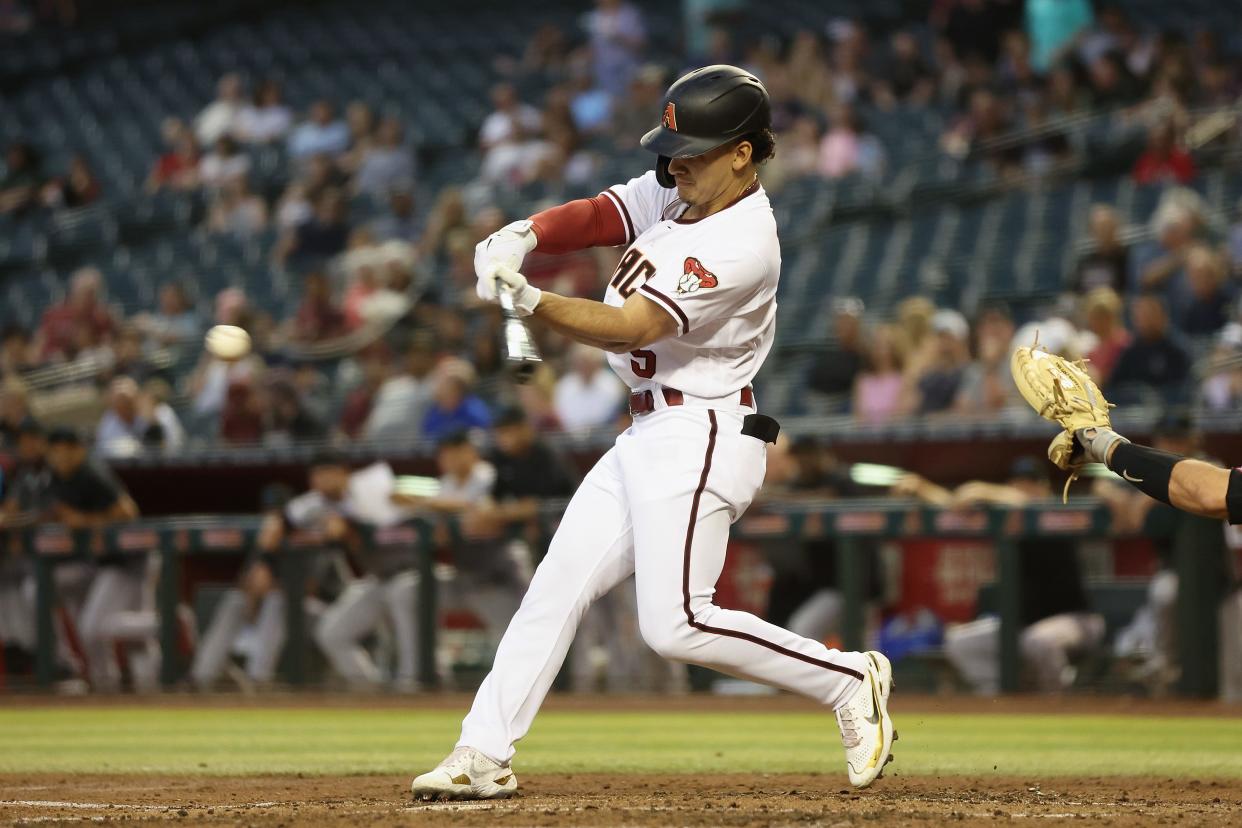 Alek Thomas #5 of the Arizona Diamondbacks bats against the Miami Marlins during the second inning of the MLB game at Chase Field on May 09, 2022, in Phoenix, Arizona.