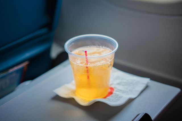 <p>Getty</p> Stock image of a drink on a tray table