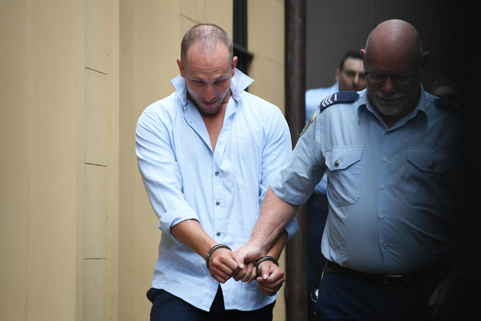 <span>Russell Brian Wood is escorted to a Corrective Services van after his sentence hearing in the Supreme Court in Sydney on Wednesday. </span>Source: AAP