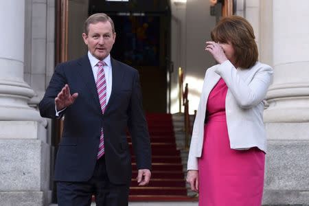 Ireland's Taoiseach Enda Kenny and Tanaiste Joan Burton depart Government Buildings after announcing the beginning of the General Election in Dublin, Ireland on February 03, 2016. REUTERS/Clodagh Kilcoyne