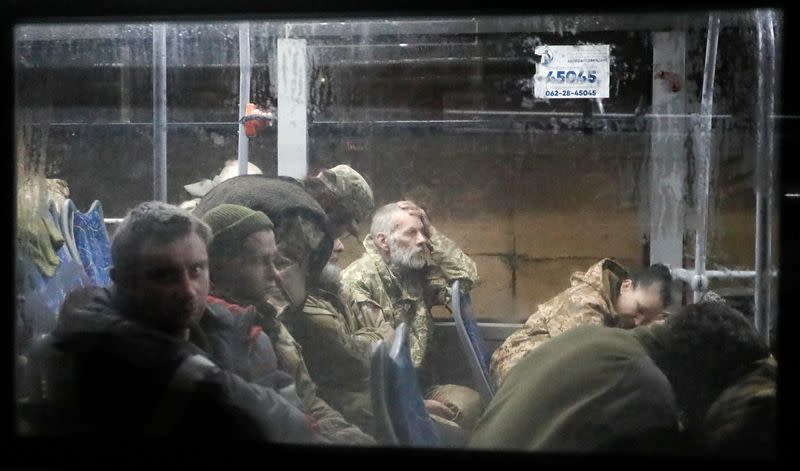 FILE PHOTO: Buses carrying Ukrainian Azovstal service members arrive in Olenivka