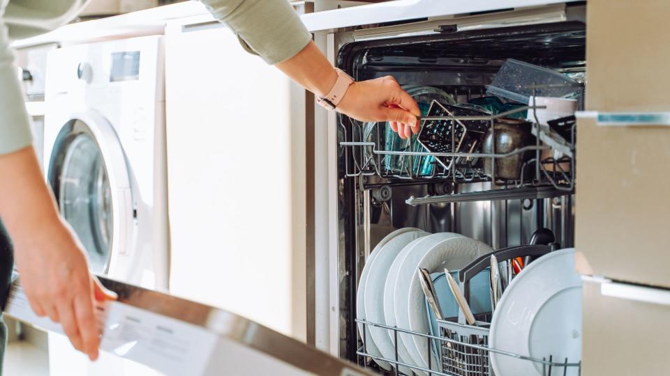 Women unloading the dishwasher