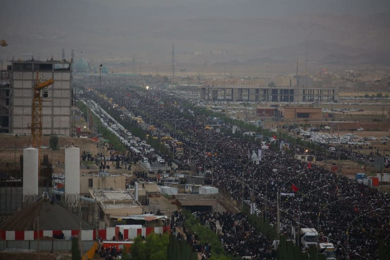 People attend a funeral procession for the late Iranian President Ebrahim Raisi, Foreign Minister Hossein Amirabdollahian and six other passengers and crew who were killed in a helicopter crash on a fog-shrouded mountainside in the northwest. Ahmad Zohrabi/dpa