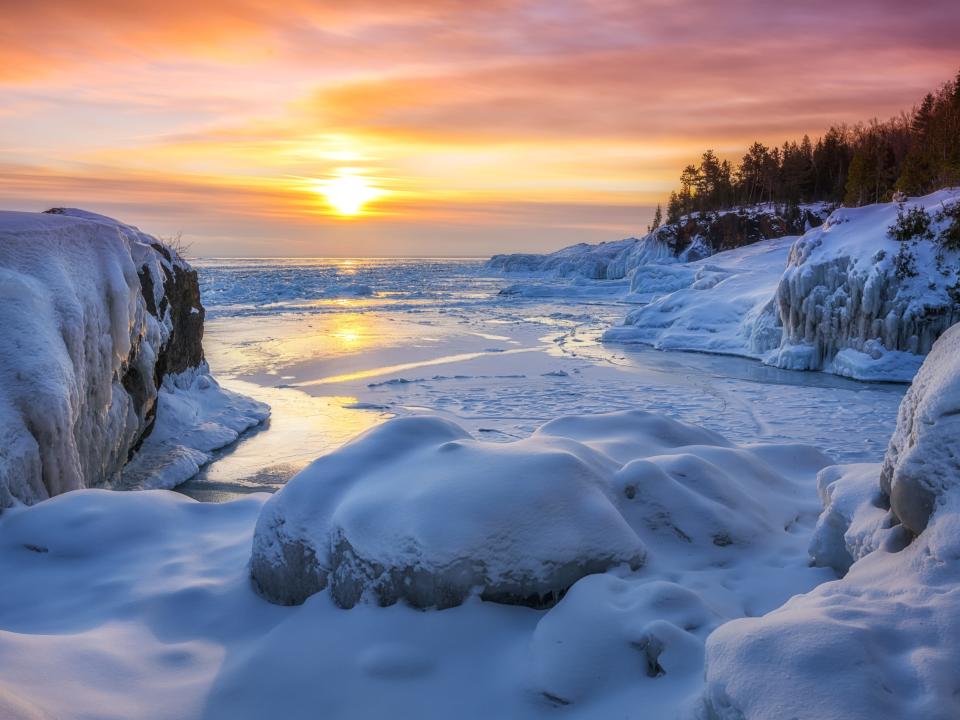 Sunrise over frozen lake in Michigan.