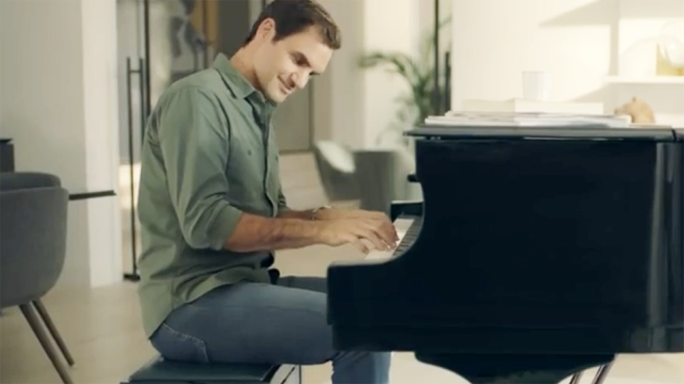 Federer plays the piano in the ad. Image: Uniqlo