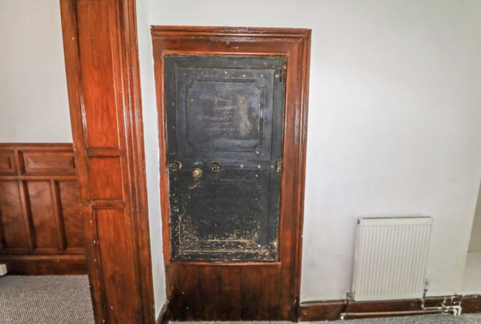 The mysterious safe is embedded in wooden panelling in one of the rooms. (Rightmove)