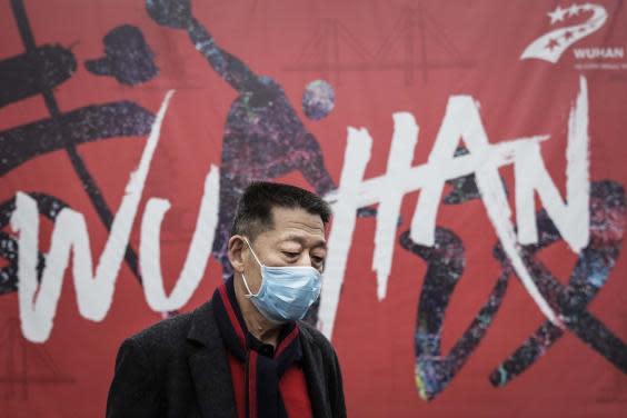 Wuhan residents have been told to wear masks in public as officials battle to halt the spread of the disease (Getty)