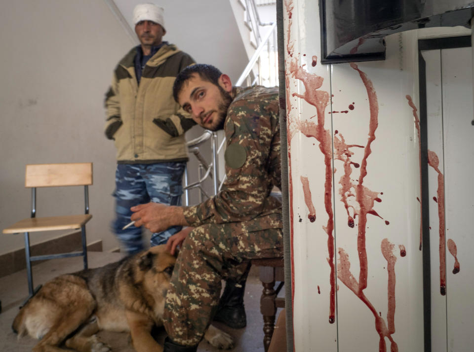 A bloody door is seen in a hospital damaged by shelling from Azerbaijan's artillery in the town of Martakert, the separatist region of Nagorno-Karabakh, Thursday, Oct. 15, 2020. The conflict between Armenia and Azerbaijan is escalating, with both sides exchanging accusations and claims of attacks over the separatist territory of Nagorno-Karabakh.(AP Photo)