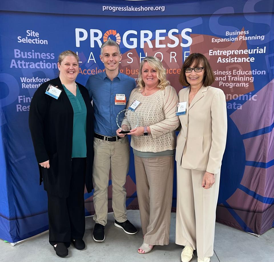 Lakeshore Foster Families & Friends collects its Community Enhancement Award at the 12th annual Progress Lakeshore Excellence in Economic Development Awards May 9.