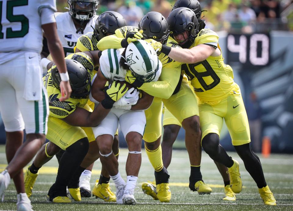 A pack of defenders bring down Portland State running back Quincy Craig as the Oregon Ducks host Portland State in the Ducks’ season opener Saturday, Sept. 2, 2023, at Autzen Stadium in Eugene, Ore.