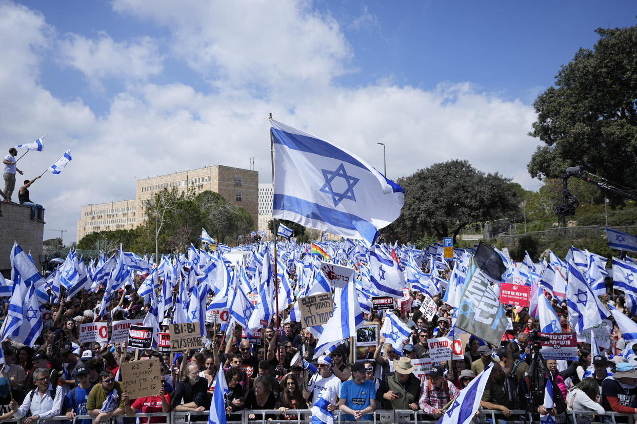 Israelis protest against Prime Minister Benjamin Netanyahu's judicial overhaul plan outside the parliament in Jerusalem, Monday, March 27, 2023. (AP Photo/Ohad Zwigenberg)