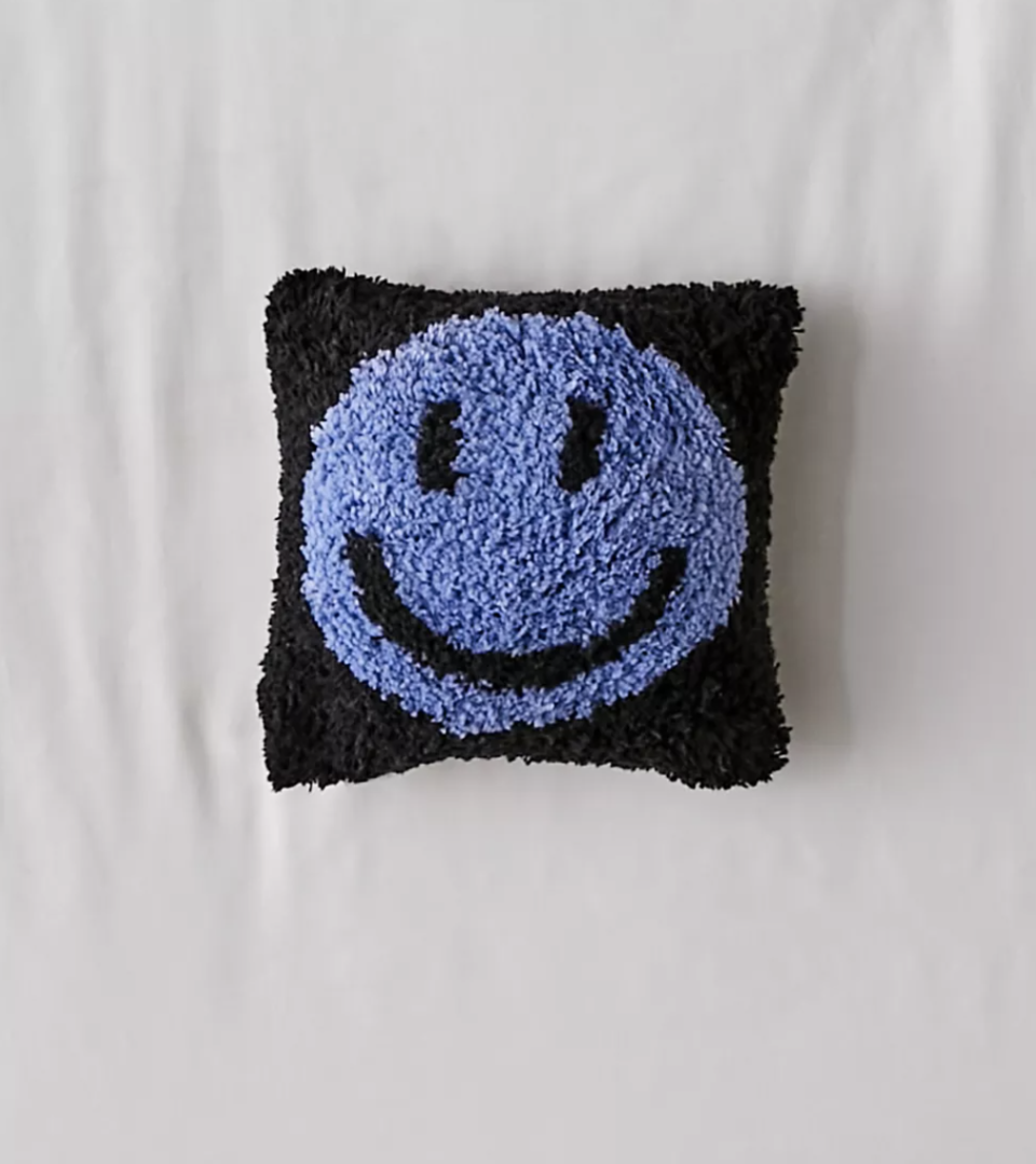 Smily Face Pillow with purple smiley and black background