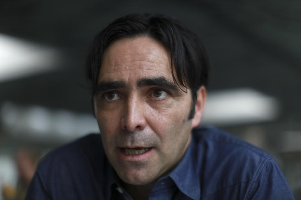 In this image taken Wednesday, June 6, 2012, Mexican film director Carlos Bolado speaks during an interview about his film, "Colosio," in Mexico City. The film which portrays the 1994 killing of the candidate who was almost certain to be the next president, casts doubts on the official conclusion that a lone gunman planned and carried out the killing of Luis Donaldo Colosio, which is often compared to John F. Kennedy's assassination. It is one of several new politically minded films being released just ahead of Mexico's July 1 election that are aimed at reminding Mexicans of the dark side of the Institutional Revolutionary Party, which governed Mexico for 71 years, and which seems set to return to power. (AP Photo/Dario Lopez-Mills)