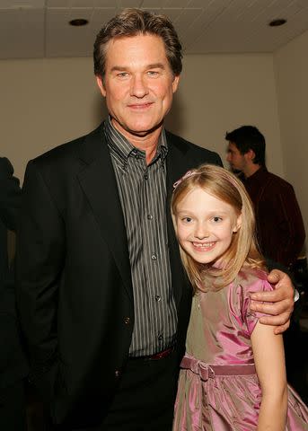 <p>Evan Agostini/Getty</p> Kurt Russell and Dakota Fanning on Sept. 10, 2005