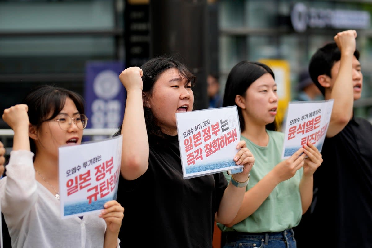 Students shout slogans during a rally to oppose the Japanese government's plan to release treated radioactive water into the sea from the Fukushima nuclear power plant, in Seoul, South Korea (AP)