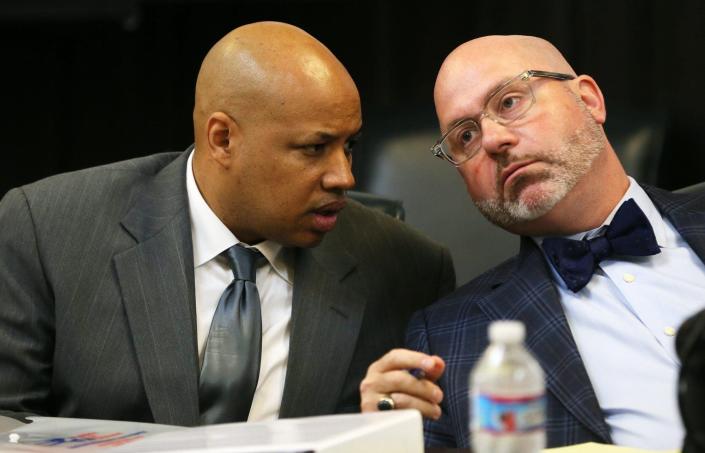 Antonio Williamson, left, a former Summit County sheriff's deputy,  confers with defense attorney Ian Friedman during a hearing in September 2018.