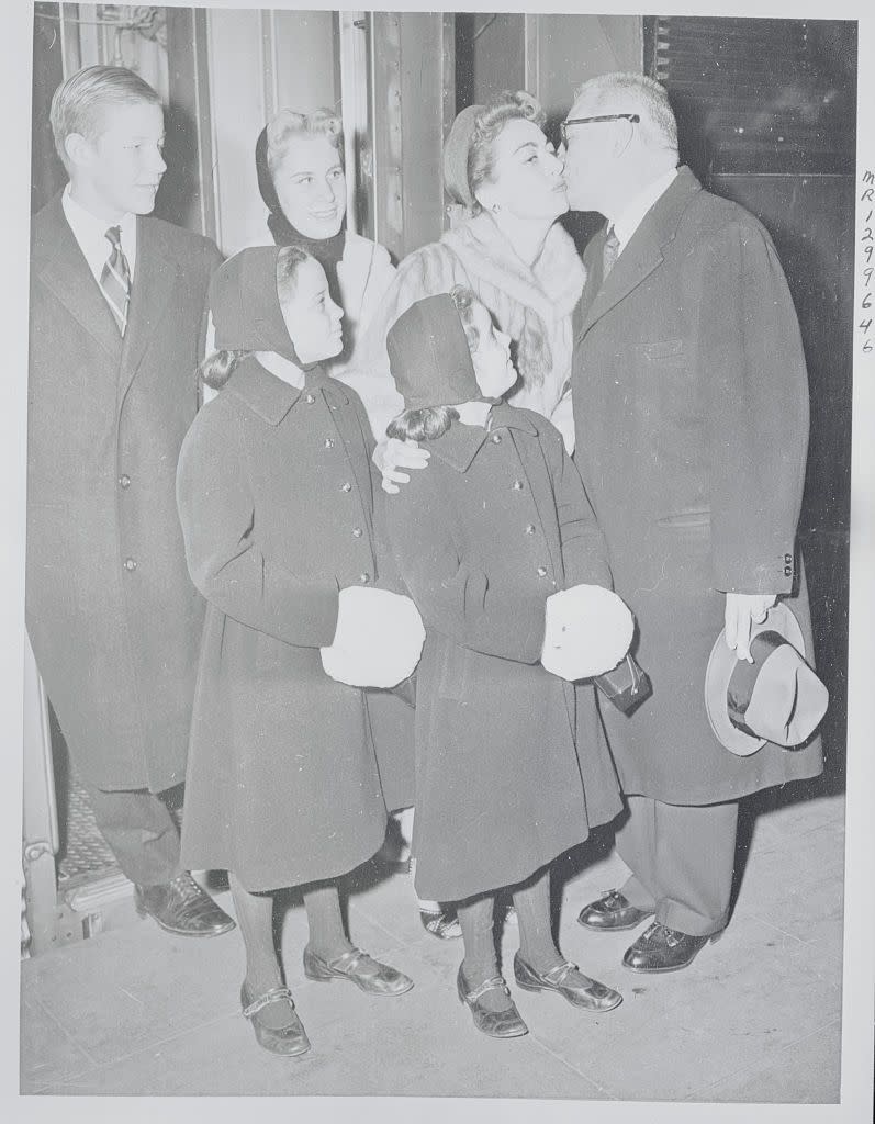 1955: Joan Crawford and her family depart for the holidays