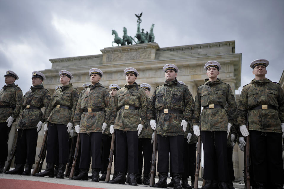 Troops get ready to take part in a welcome ceremony for Britain's King Charles III and Camilla, the Queen Consort, in front of the Brandenburg Gate in Berlin, Wednesday, March 29, 2023. King Charles III arrives Wednesday for a three-day official visit to Germany. (AP Photo/Markus Schreiber)