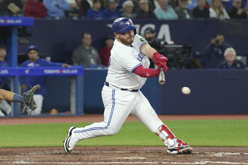 Toronto Blue Jays' Alejandro Kirk hits a two-run single off Tampa Bay Rays relief pitcher Zack Littell during the third inning of a baseball game Friday, Sept. 29, 2023, in Toronto. (Chris Young/The Canadian Press via AP)