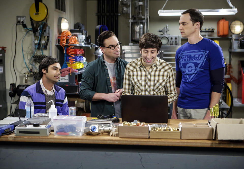 group looking over a computer in a lab