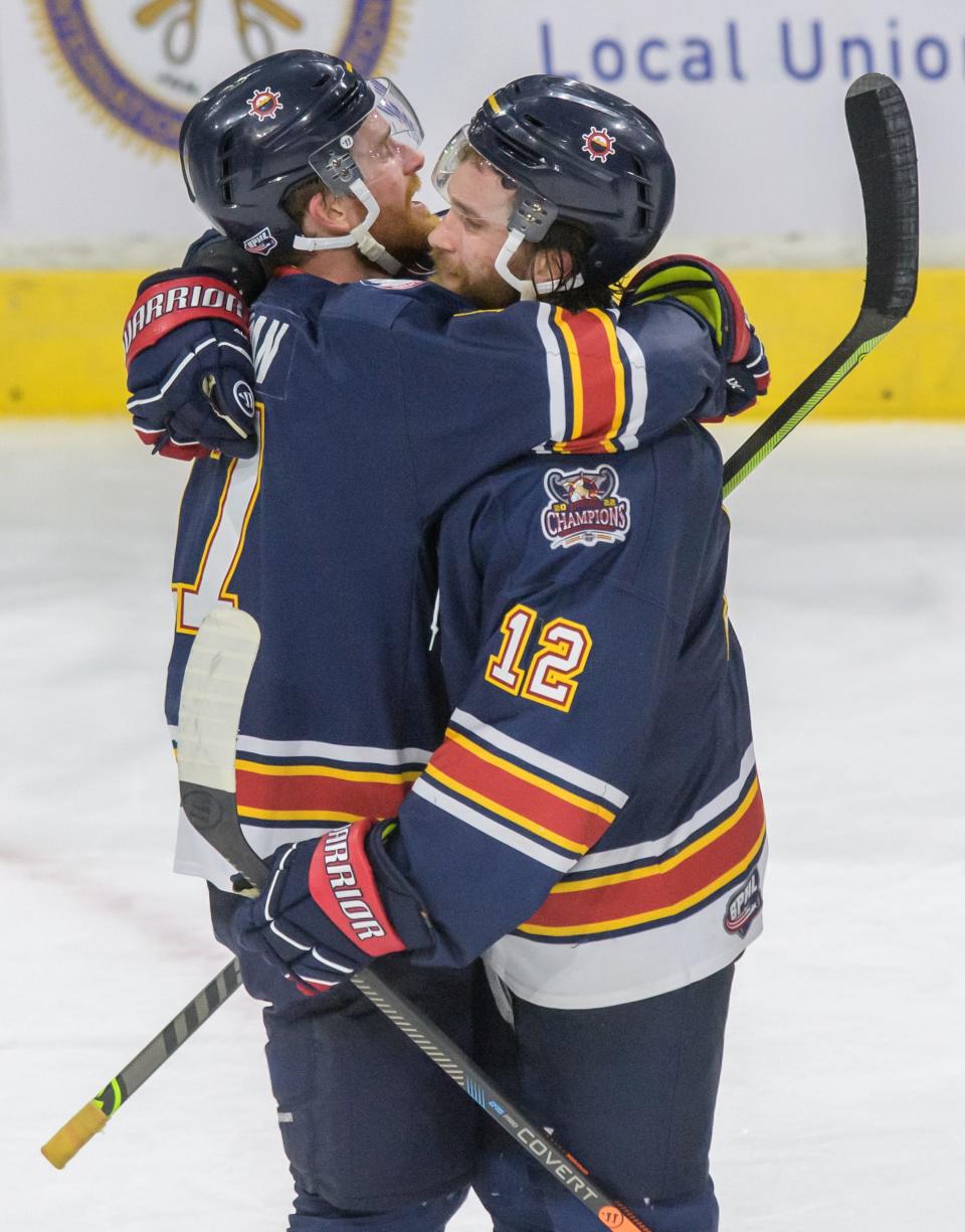 Peoria's Alec Hagaman, left, and Jordan Ernst hug after their 2-1 victory over Pensacola on Saturday, April 15, 2023 at Carver Arena. The Rivermen advanced to the semifinals of the SPHL playoffs.