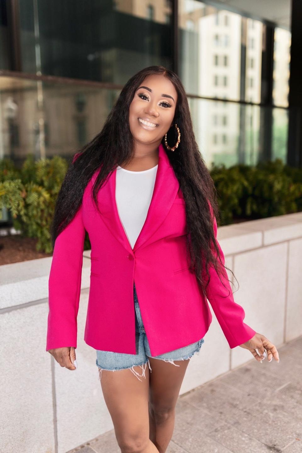 May 2021- Ayana Bean of Brockton is all smiles posing outside luxe Boston office space after receiving news of being on one of Amazon's bestsellers lists for her self-published book "A Year And A Day: Memoirs of a Regular Girl."