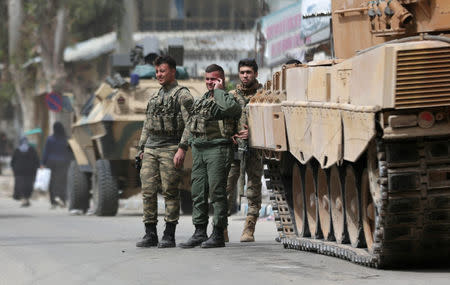 Turkish soldiers are seen in the center of Afrin, Syria March 24, 2018. REUTERS/Khalil Ashawi