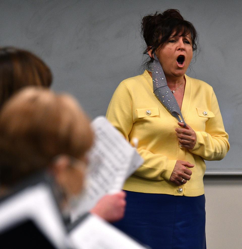 Ukraine native Lena Karpii, now of Natick, sings the Ukraine National Anthem during rehearsals. Karpii's family and son, a journalist, are still in Ukraine.