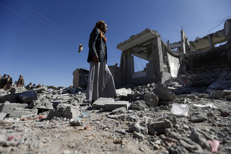 Checking the damage in the aftermath of a reported airstrike on San'a by the Saudi-led coalition.