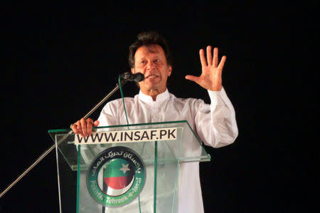 Imran Khan, chairman of the Pakistan Tehreek-e-Insaf (PTI) political party, gestures as he addresses his supporters during a rally in Lahore, Pakistan April 29, 2018. REUTERS/Mohsin Raza