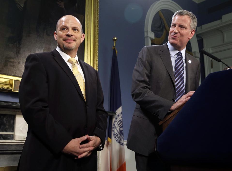 As New York City Mayor Bill de Blasio, right, and President of the United Federation of Teachers Michael Mulgrew participate in a news conference at City Hall in New York, Thursday, May 1, 2014. New York City and its largest teachers union struck a deal on a new contract Thursday, ending a nearly five-year labor dispute and potentially setting a template for negotiations with the city's other unions. (AP Photo/Seth Wenig)