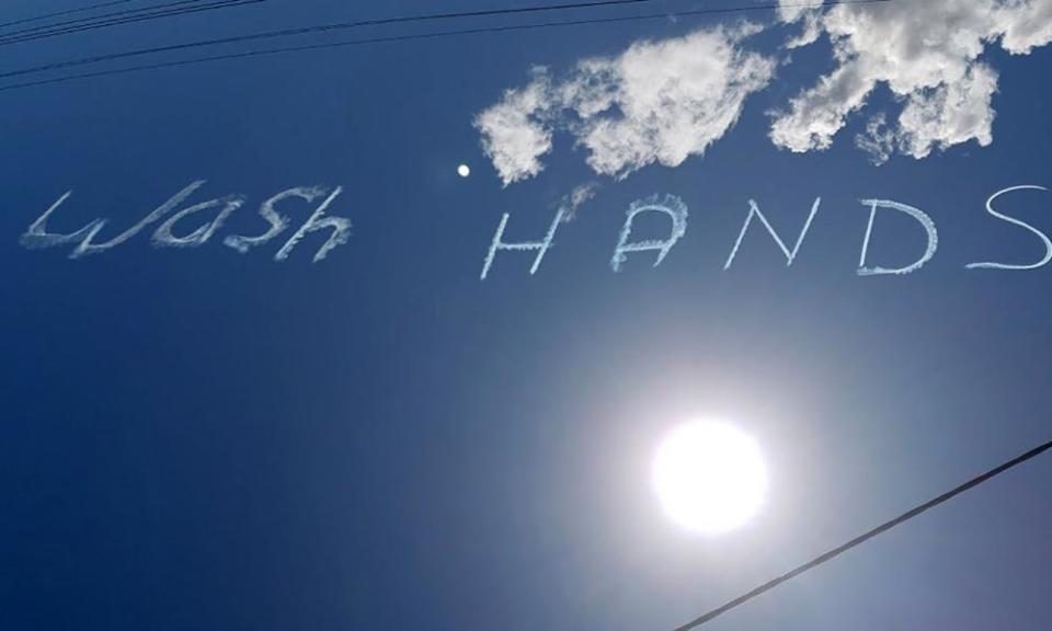 ‘Wash hands’ written in the sky above Sydney on March 13, 2020.