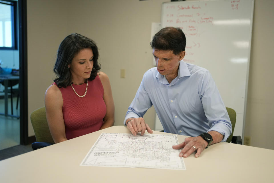 FILE - Nevada Republican Senate hopeful Sam Brown, right, speaks with his wife Amy Brown at in a campaign office Tuesday, June 14, 2022, in Las Vegas. Brown made his long-awaited U.S. Senate candidacy official on Monday, July 10, 2023, jumping into the race to take on Democratic incumbent Jacky Rosen a year after losing the Republican nomination to challenge Nevada's other U.S. senator.(AP Photo/John Locher, File)