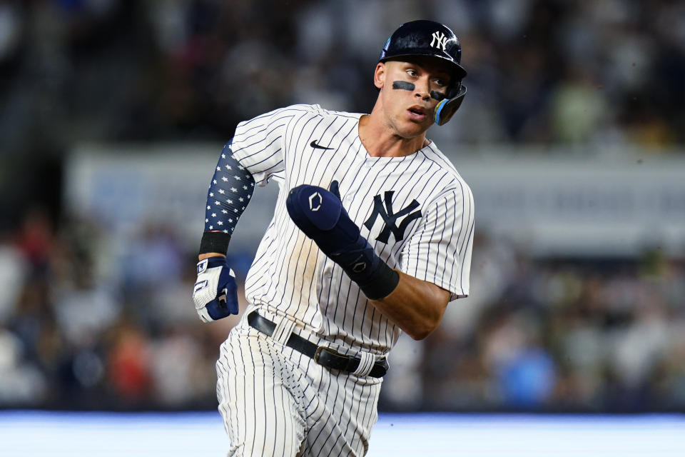 New York Yankees' Aaron Judge advances to third base on a double by Anthony Rizzo during the sixth inning of the team's baseball game against the Cincinnati Reds on Thursday, July 14, 2022, in New York. (AP Photo/Frank Franklin II)