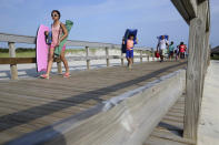 <p>People stream onto the beach at Island Beach State Park after it reopened at 8 in the morning Tuesday, July 4, 2017, in Seaside Park, N.J. New Jersey’s budget stalemate between Republican Gov. Chris Christie and the Democrat-controlled Legislature had resulted with the state government shut down and state parks closed to the public until late Monday night, just in time for the Fourth of July. (Photo: Mel Evans/AP) </p>